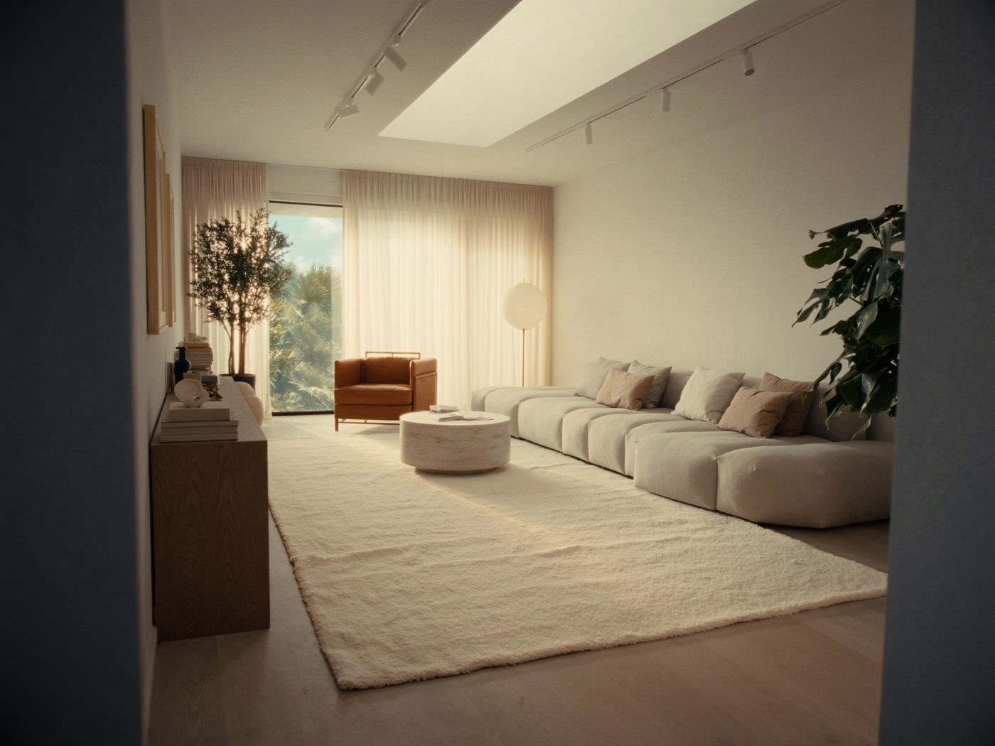 Rendered living room with grey sofa, coffee table and armchair